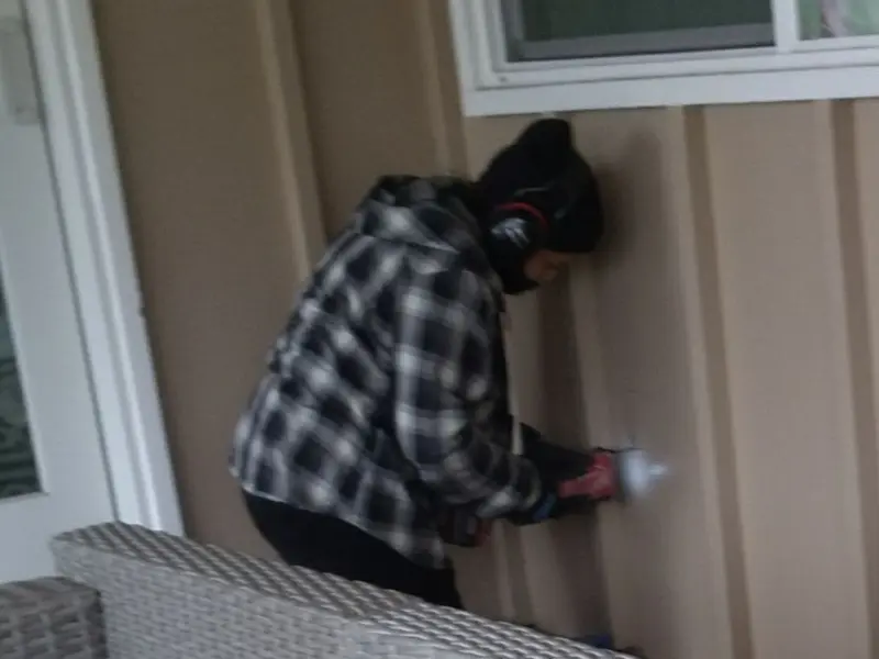 Professional electrician installing an exterior outlet in Melissa