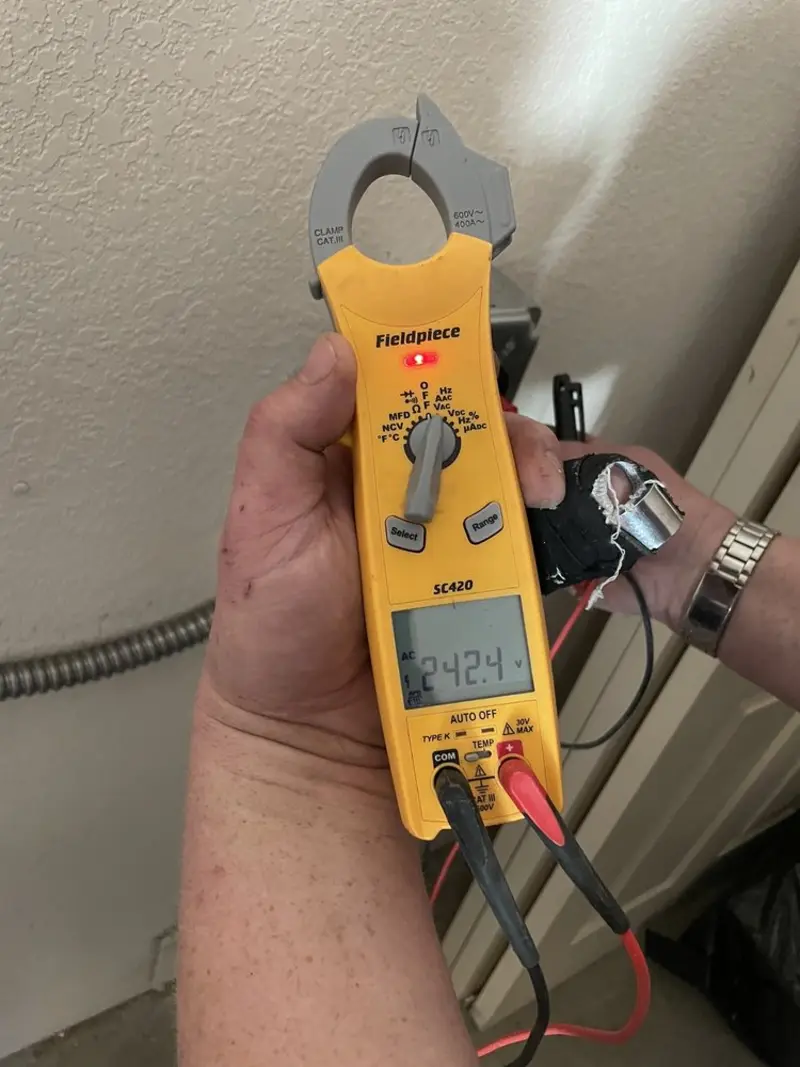 Voltage testing with clamp meter during Electrical Installation Services in Melissa
